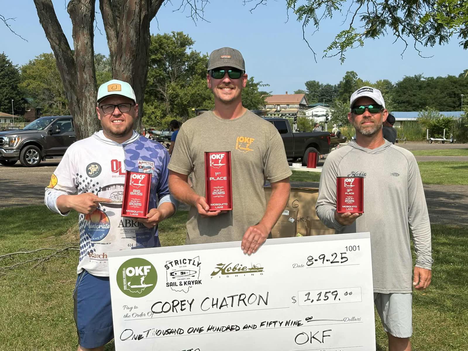Three OKF anglers with trophies and an award check at Mosquito Lake in August 2025