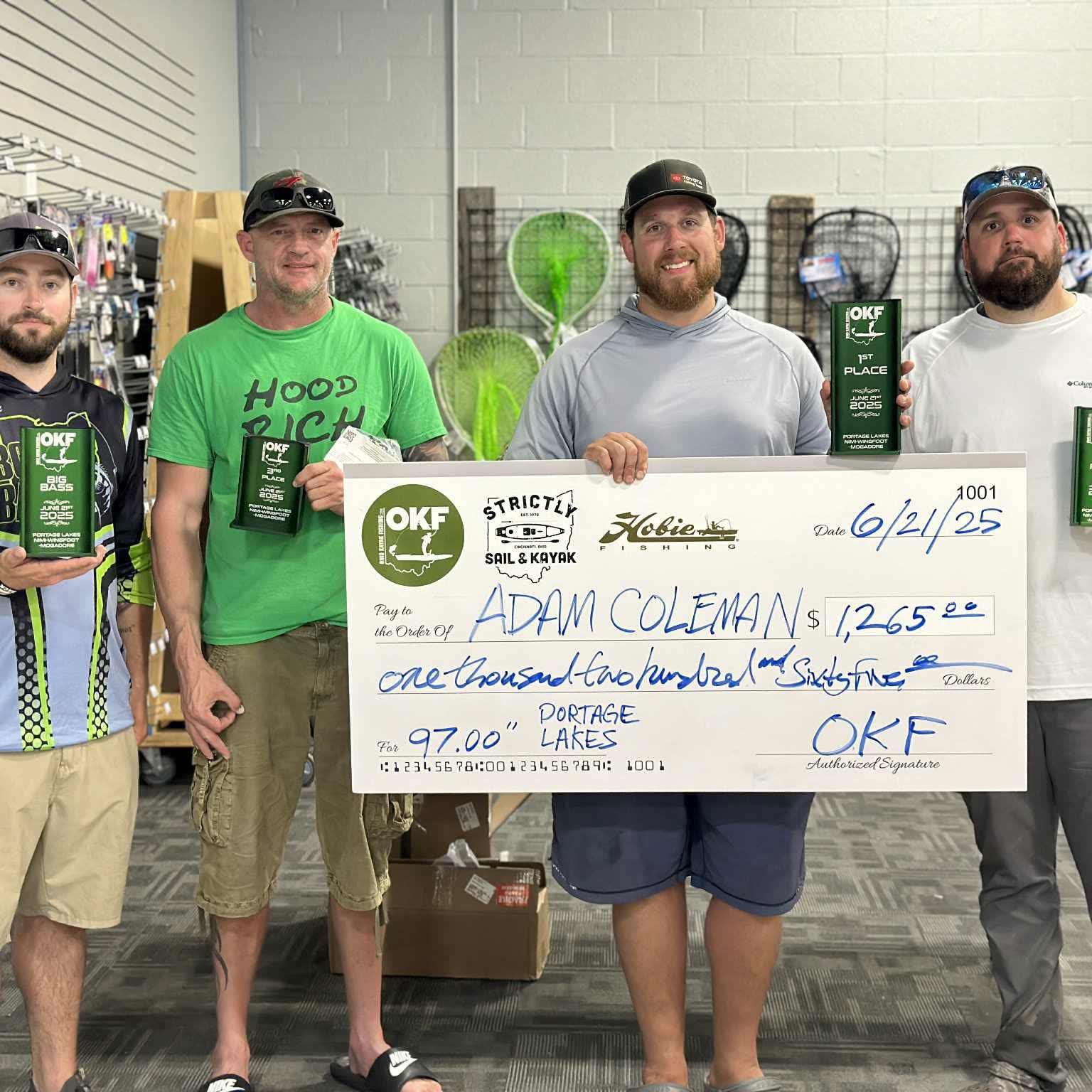 Four OKF anglers with trophies and an award check from the June 2025 Portage Lakes event